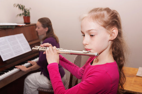  girl with flute and teacher