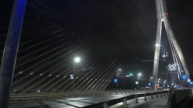 Night city and bridge in fog. Riga, Latvia. December 2016. 4K UHD