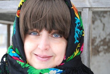 a woman in a colorful headscarf