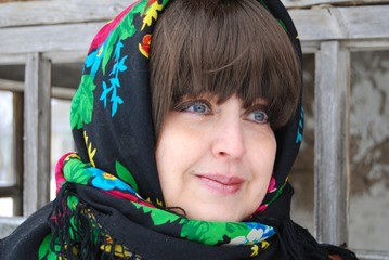a woman in a colorful headscarf