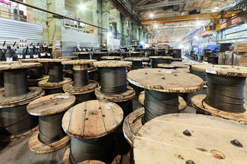 Large cable reels stocked in the factory premises.