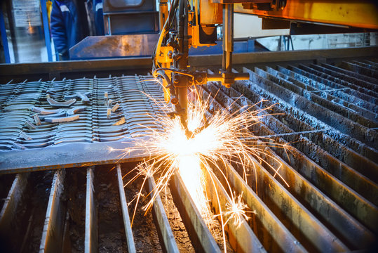 Oxygen torch cuts steel sheet.