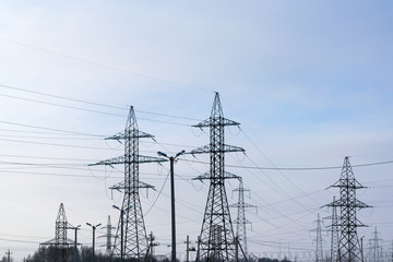 Several metal electricity pylon in the field.