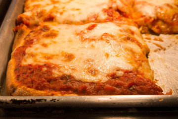 Delicious authentic New York style Sicilian pizza  in pan 