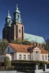 Fototapeta premium Neoclassical house and towers of the Basilica Archdiocese of Gniezno.