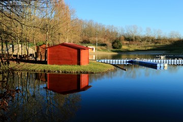 reflection of a wooden hut in the pond , park of Avion , Pas de Calais , hauts de France , France in winter , december 2016

