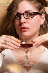 young woman drinking liqueur
