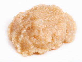 portion of salty caviar of herring on white plate