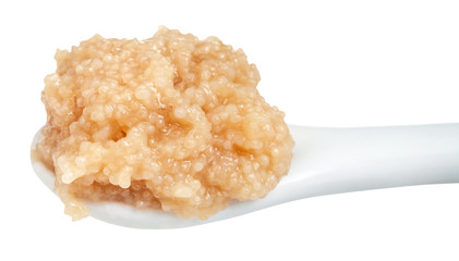 salty caviar of herring in ceramic spoon isolated