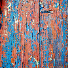 old wooden background with worn and cracked paint from time to time