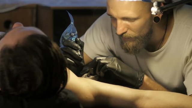 Getting a tattoo. Close-up, toned image