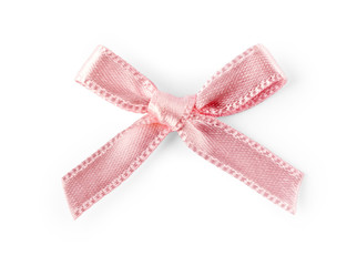 Pink satin ribbon with a bow isolated on white background
