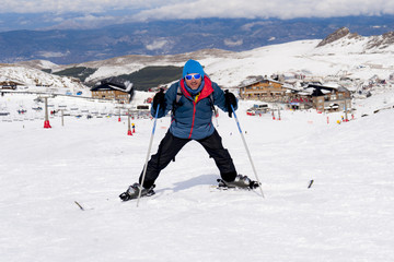 Fototapeta na wymiar happy man happy in snow mountains at Sierra Nevada ski resort in Spain