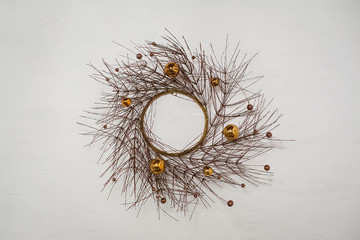 Fototapeta premium wreath of dry branches of a tree decorated with balls