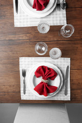Elegant table appointments with red napkin