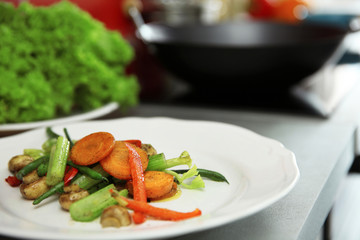 Cooked vegetables on plate closeup