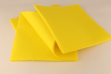 Yellow microfiber napkins for cleaning on a white background