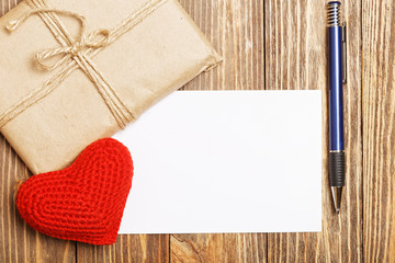 Gift parcel, white blank label and red heart