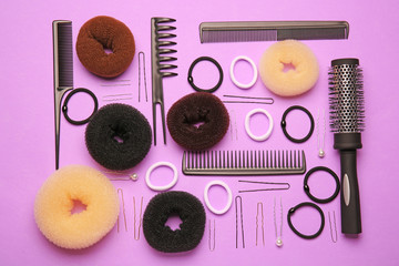 Fototapeta na wymiar Flat lay of accessories for hairstyle on purple background