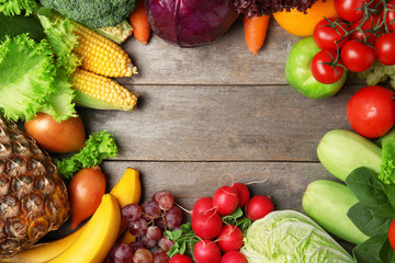 Fruits and vegetables on wooden background