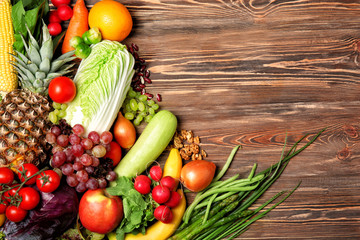 Fruits and vegetables on wooden background