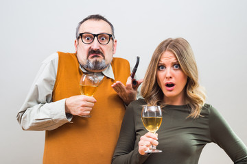 Nerdy man is trying to get beautiful woman's attention but she is not interested and desperately thinking the way to escape.
