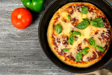 Freshly baked pizza in a pan