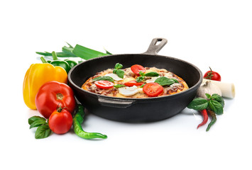 Freshly baked pizza in a pan on white background