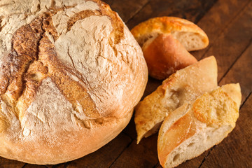 Fresh bread on wooden table closeup