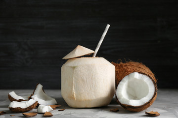 Fresh coconut cocktail on dark background