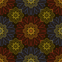 Doodle seamless image. Mandala, circular patterns. Yellow, blue and red on black. Hand drawing