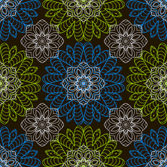 Doodle seamless image. Mandala, circular patterns. White, blue and green on black. Hand drawing
