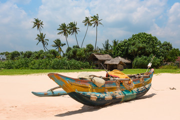 Naklejka na ściany i meble Traditional fishing boat on Sri Lanka beach