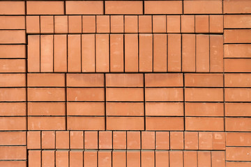 High resolution texture of a red brick wall. Laying horizontal t