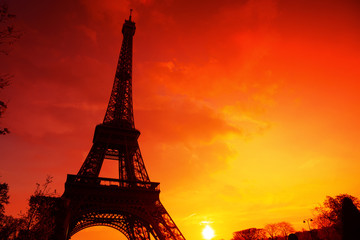 Eiffel Tower silhouette at evening sunset light in Paris France