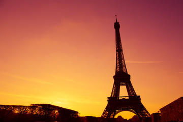 Eiffel Tower silhouette at evening sunset light in Paris France