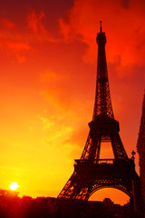 Eiffel Tower silhouette at evening sunset light in Paris France