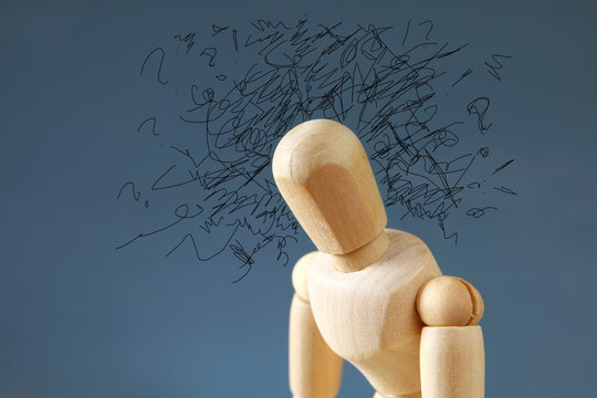 wooden dummy  with worried stressed thoughts