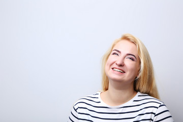 Portrait of beautiful woman on grey background