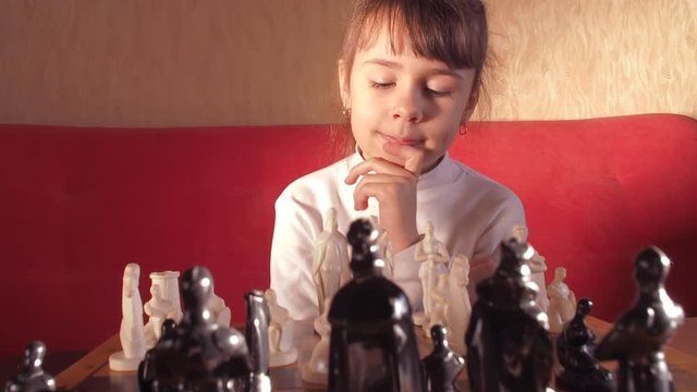 Child playing chess.