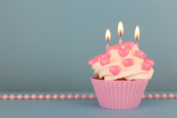 pink cupcake and pink pearls