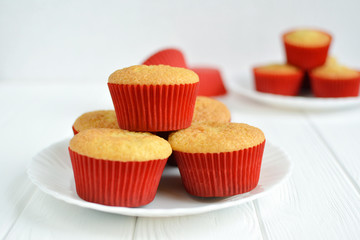 Homemade cupcakes in a white plate on white background