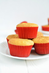 Homemade cupcakes in a white plate on white background