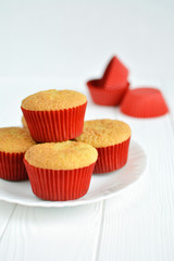 Homemade cupcakes in a white plate on white background