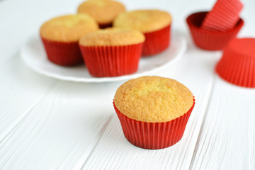 Homemade cupcakes in a white plate on white background