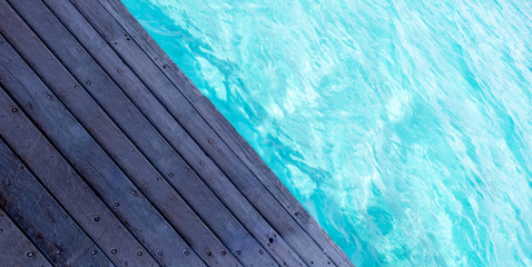 Obraz premium Wooden floor with sea background. 