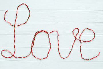 The red word love on a white background
