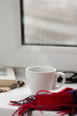 Fototapeta na wymiar cup of black coffee on a white background, red cloth