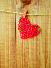 retro wooden heart to the old twine on the background of  wood, to Valentinov day, symbol, space
