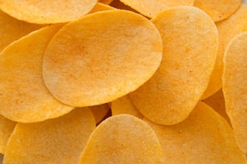 Close up potato chips on wood top view background.